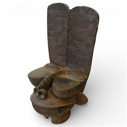 African carved hardwood ceremonial seat, monoxylous construction with twin dished seat wel...
