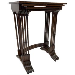 20th century inlaid mahogany quartetto nest of four tables, rectangular top inlaid with birdseye maple oval panel, ring turned supports on sledge feet