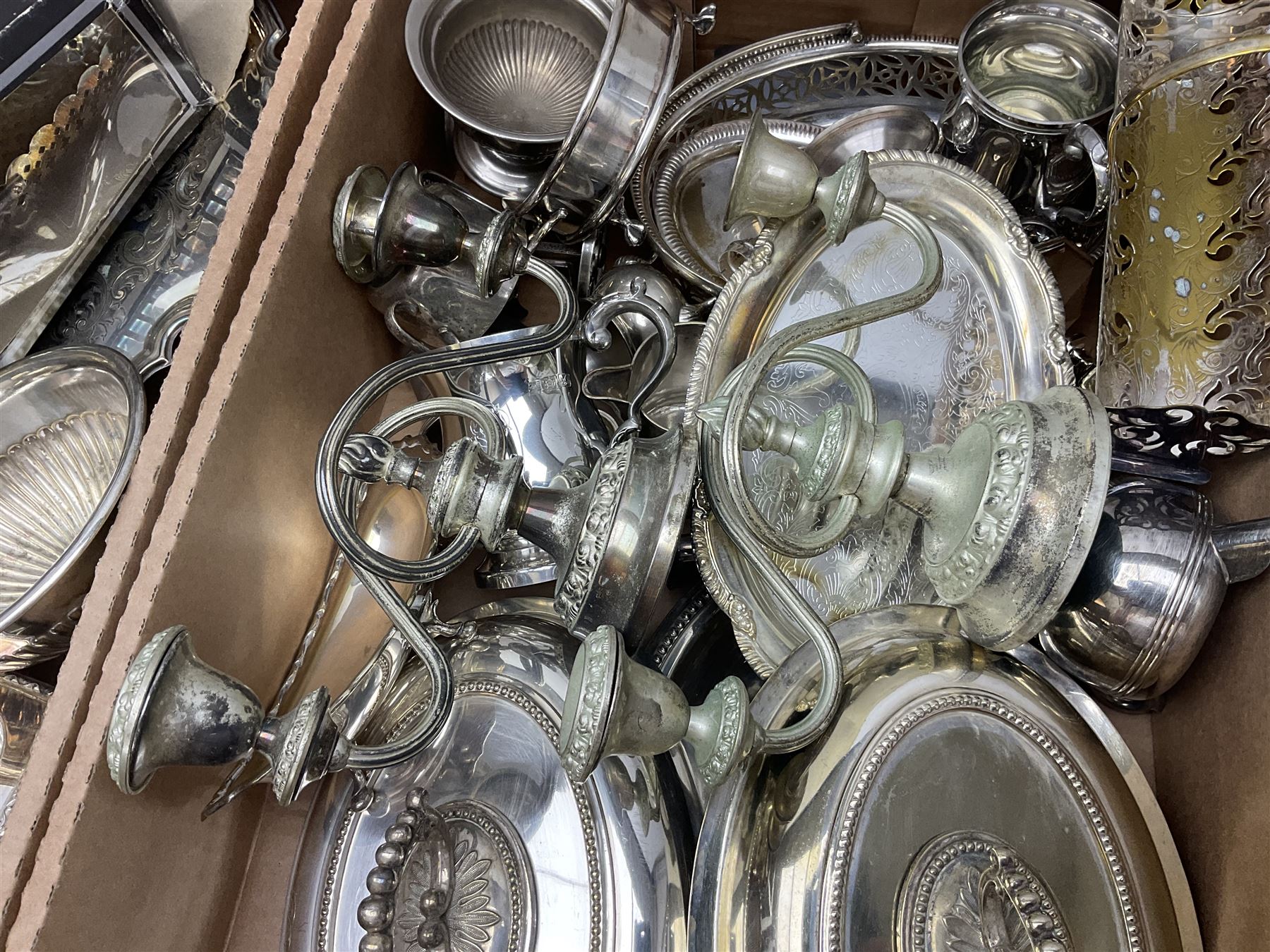 Quantity of silver plate and other metal ware, including sugar caster, tureens, serving dishes, pair of candelabra etc, in two boxes 