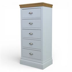 Modern narrow chest of five drawers in white finish with oak moulded top, with metal cup handles raised on a moulded plinth base