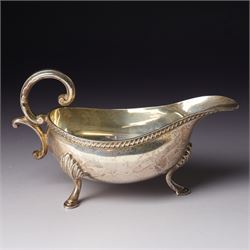 George V glass whisky noggin with hinged silver lid H10.5cm Birmingham  1912 and a silver sauce boat with C scroll handle Birmingham 1973 (2)