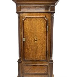 A mid-19th century 8-day oak and mahogany longcase clock retailed by John Stokes of Knutsford c 1840, with a swans neck pediment, three ball and eagle spun brass finials and brass paterae, square hood door flanked by ring turned pilasters, trunk with reeded quarter columns and capitals with a raised mahogany panel, short inlaid trunk door with a flat top and concave corners, plinth raised on decorative feet with canted corners and a conforming raised panel, fully painted dial with matching spandrels depicting country churches and yellow flowers on a gold lustre ground, broad Roman numerals, minute track, matching brass “crown” hands, subsidiary seconds dial and semi-circular date aperture with calendar disc behind, dial pinned via a Walker cast iron false plate to a weight driven rack striking movement, striking the hours on a bell. With pendulum, weights and key. Original casemakers label nailed to the rear of the case with the clockmakers name handwritten in ink. H216 W51 D23
John Stokes is recorded as working in Knutsford (Cheshire)  1834-48.


