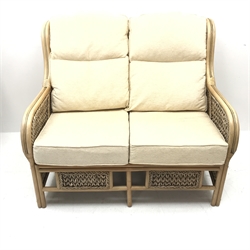 Two seat cane and bamboo conservatory sofa, cushions upholstered in pale gold (W122cm) and pair matching armchairs (W67cm)