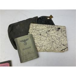 WW2 German War Pass (Wehrpass) identification paperwork for Walter Fensterseifer 2nd type booklet dated 8/6/1940, with signed photo of recipient in civilian suit. Born 31st January 1921. Numerous entries; together with quantity of small private photographs of German soldiers; One Million mark banknote 1923; 30th Corps in Germany booklet with Formation badge; and other WW2 paper ephemera