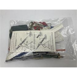 Action Man - five figures marked on the back 'Made in England by Palitoy under licence from Hasbro 1964', one dressed as a German Stormtrooper, one as a Red Devil Pilot and three in army uniform; another similar action figure marked to the right buttock ' G.I. Joe Copyright 1964 by Hasbro Patent Pending Made in Canada' dressed in army uniform; together with an Action Man jeep, field gun, mortar and machine guns and other accessories including helmets and weapons, parachute, diving equipment, skis and snow shoes, boots, uniforms etc; all unboxed