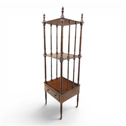Late Victorian mahogany whatnot, the three tiers supported by turned spindle uprights with turned finials, fitted with a single frieze drawer, raised on turned supports with brass castors