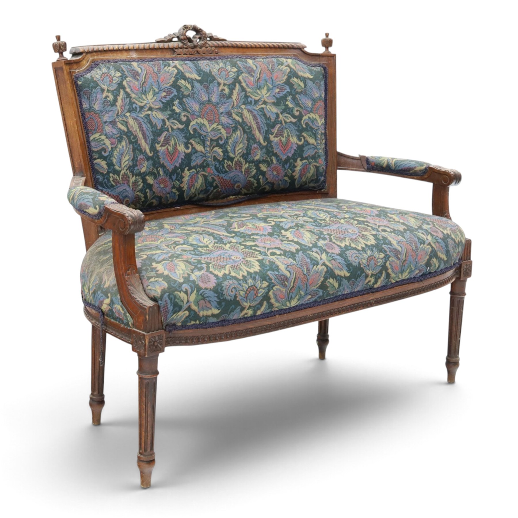 20th century French Louis XVI style stained beech two-seat salon settee, rectangular upholstered back and seat in floral tapestry fabric, carved and moulded frame with foliate cresting, padded open arms and fluted tapering supports