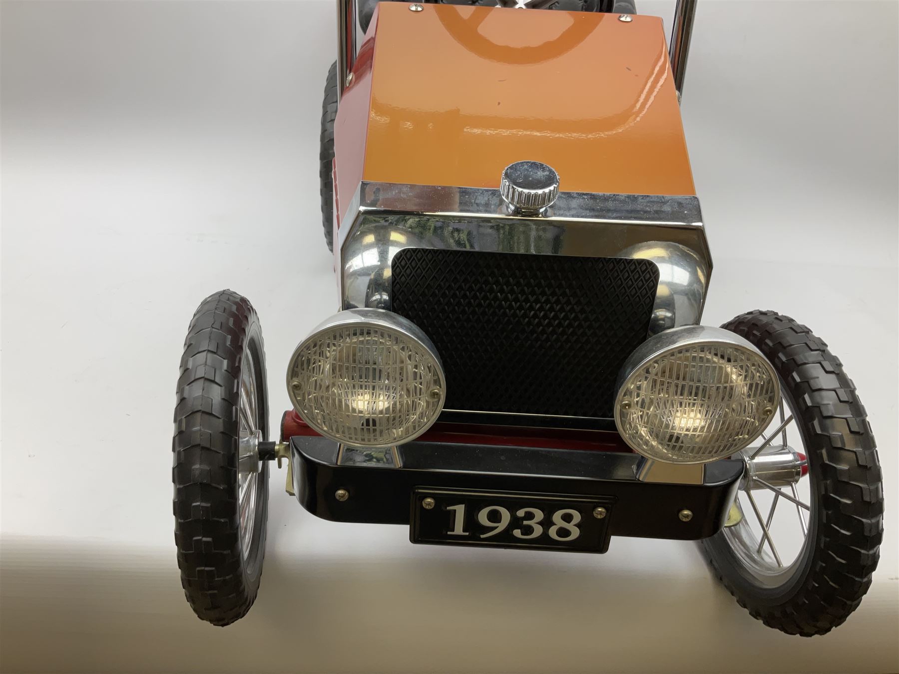 Red child's tin-plate pedal car with chrome detail, by Posh Paddles, Scarborough, H56cm, L80cm