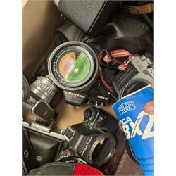 Collection of cameras, including Canon EOS 650, Praktica BMS, Inovar, Praktica MTL3, Zeiss Ikon Contina, etc