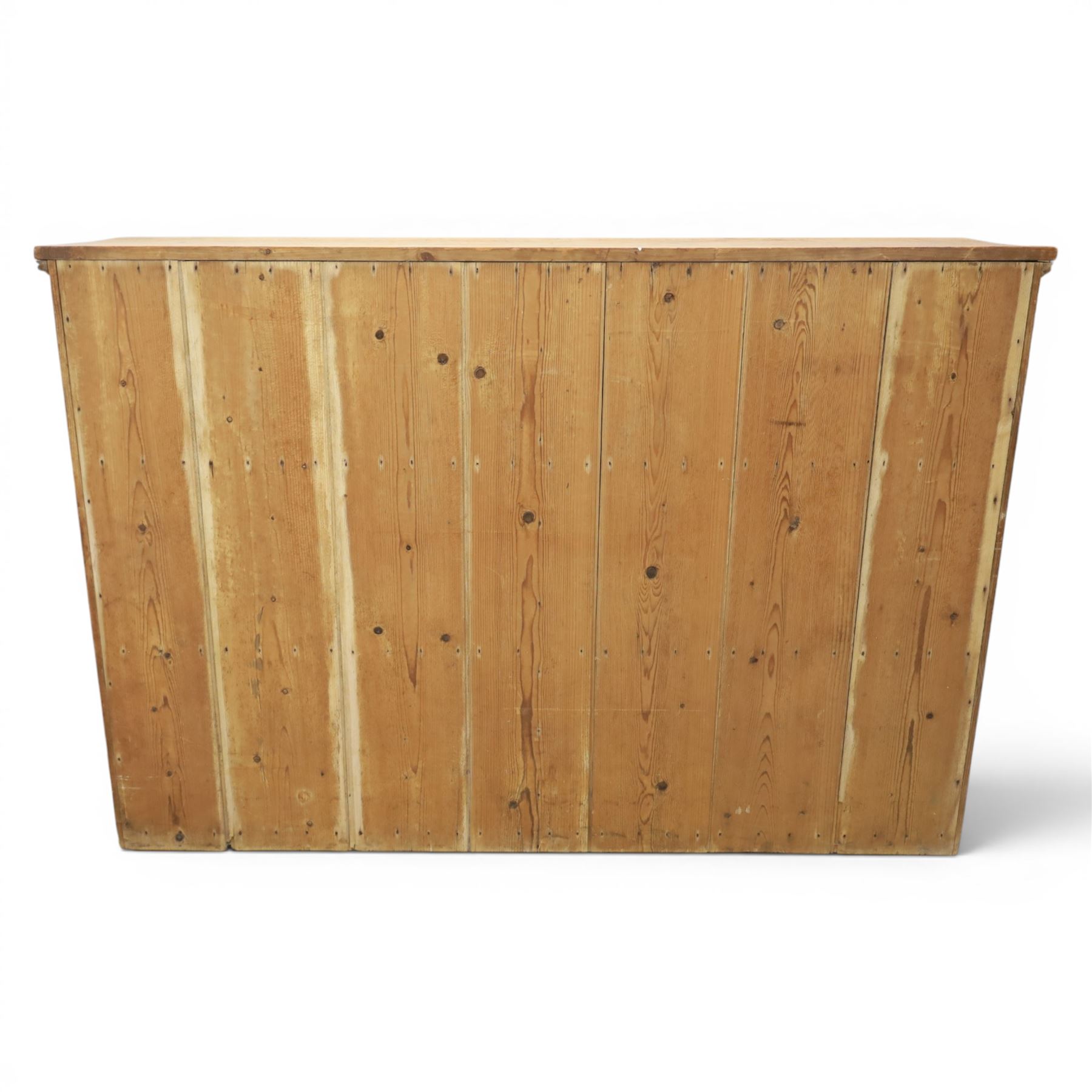 Victorian waxed pine low cupboard, fitted with two panelled doors and panelled sides, two interior shelves