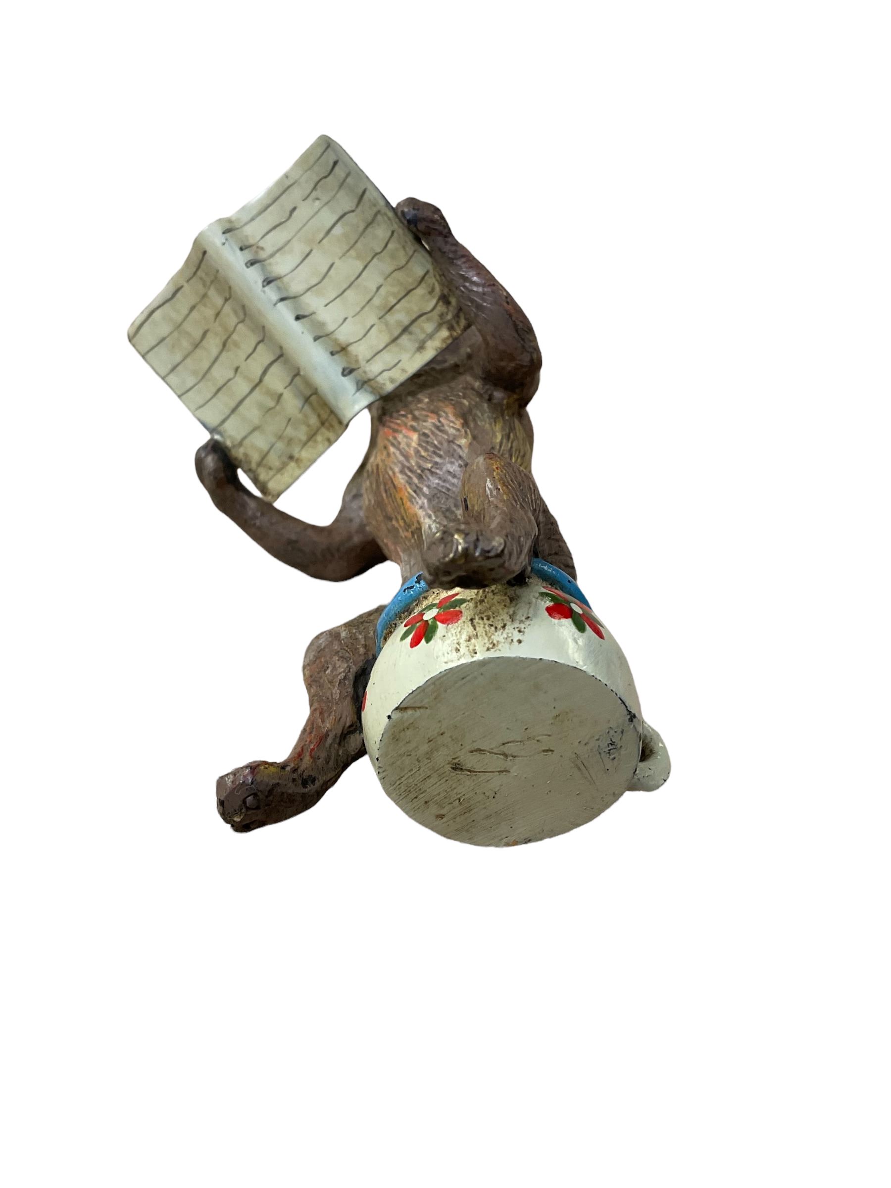 After Franz Bergmann (1861-1936): Austrian cold painted bronze figure of a pug dog reading a book, sitting on a chamber pot, with Bergmann type mark beneath H8cm