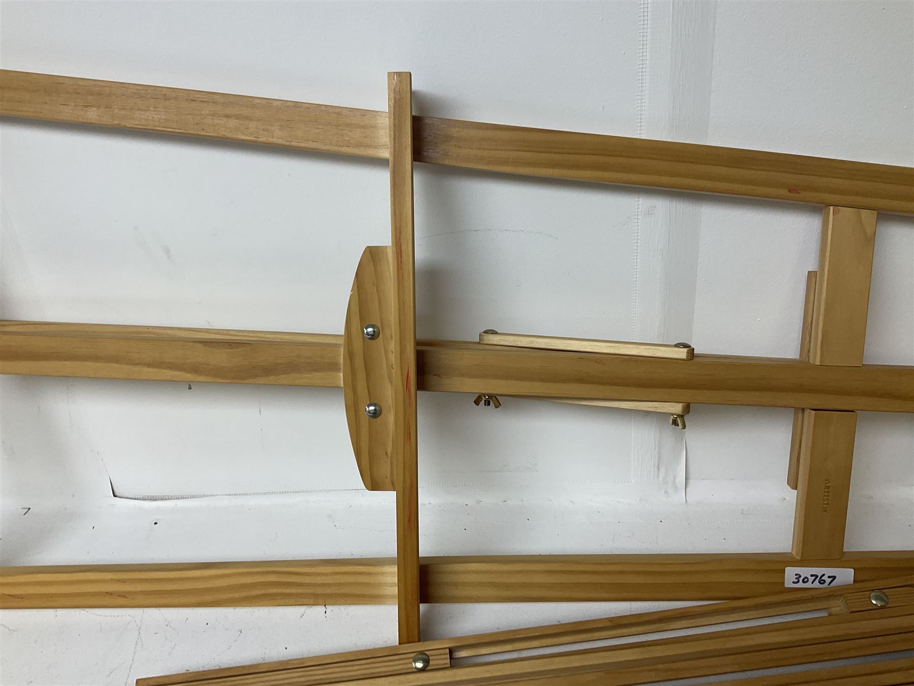 Boldmere wooden artists easel, together with a similar wooden easel by Artistik and Aboriginal artwork on fabric, tallest easel H143cm