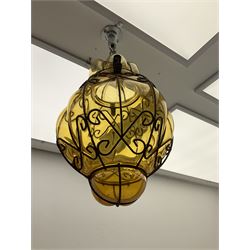 Continental ceiling light amber glass encased in an iron frame 38cm. 