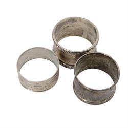 Group of silver, including three napkin rings, three spoons, sugar tongs, three thimbles, vesta case, chain and fob, together with a collection of coins