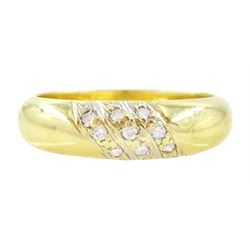 Gold diamond ring, rubover set with nine round brilliant cut diamonds