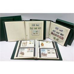 Three albums containing Isle of Man mint stamps including some miniature sheets etc and various Isle of Man first day covers