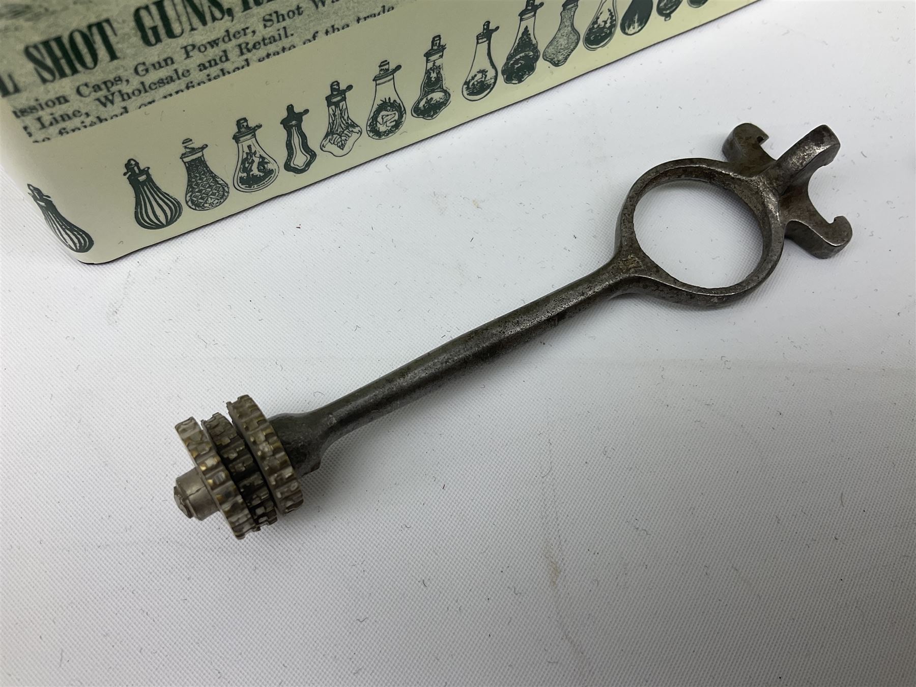 Riling Ray: The Powder Flask Book. 1992 R&R Books facsimile edition of the 1953 original; four powder measures including two by G. & J.W. Hawksley with horn handles; 16-bore combined spent cartridge and broken case remover; and turnscrew screw-driver (7)