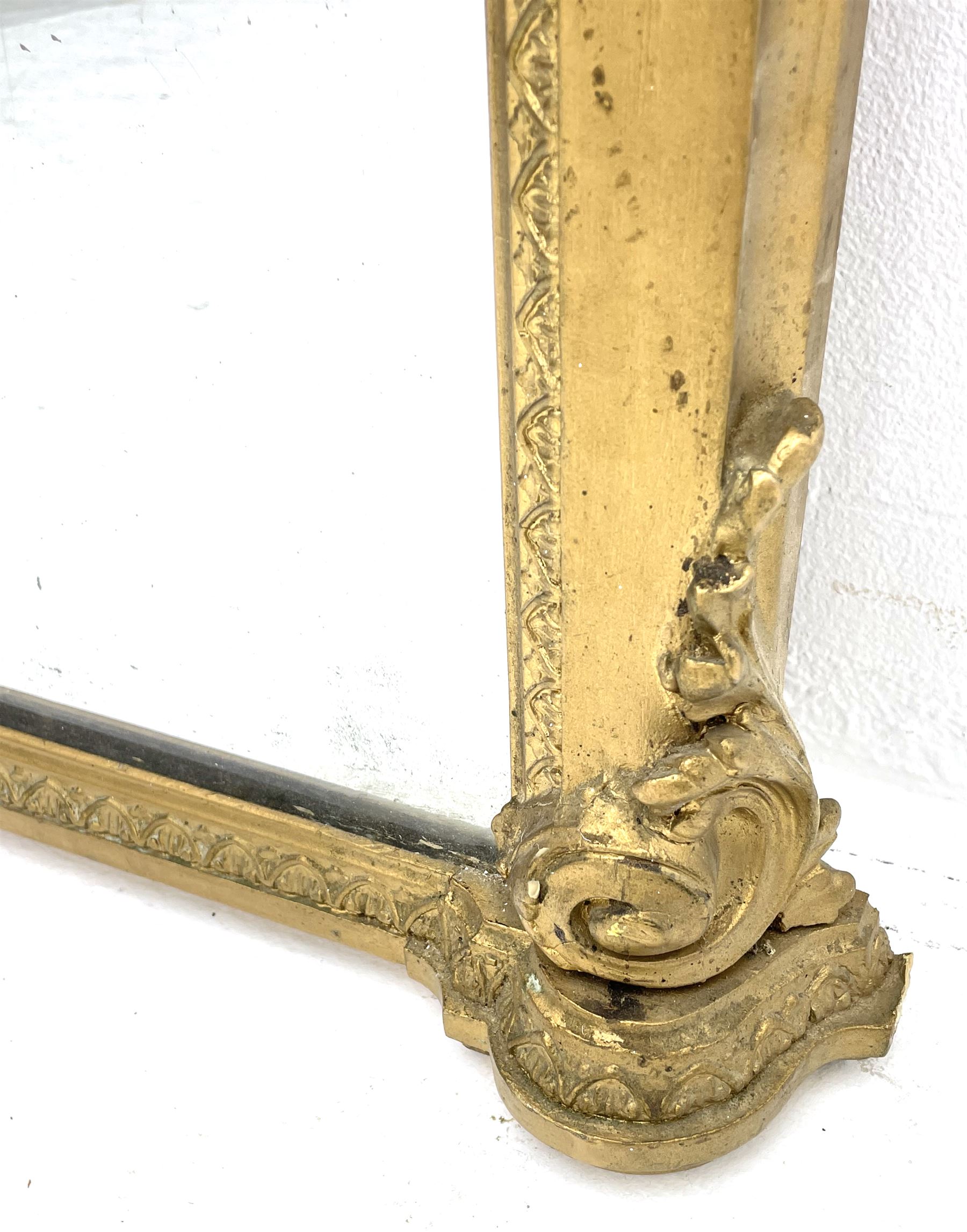 Tall Victorian hall mirror, in arched gilt frame with foliate mould slip, acanthus scroll corner brackets 