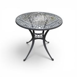 Circular aluminium garden table and pair of armchairs chairs with a pierced and scrolling backs 