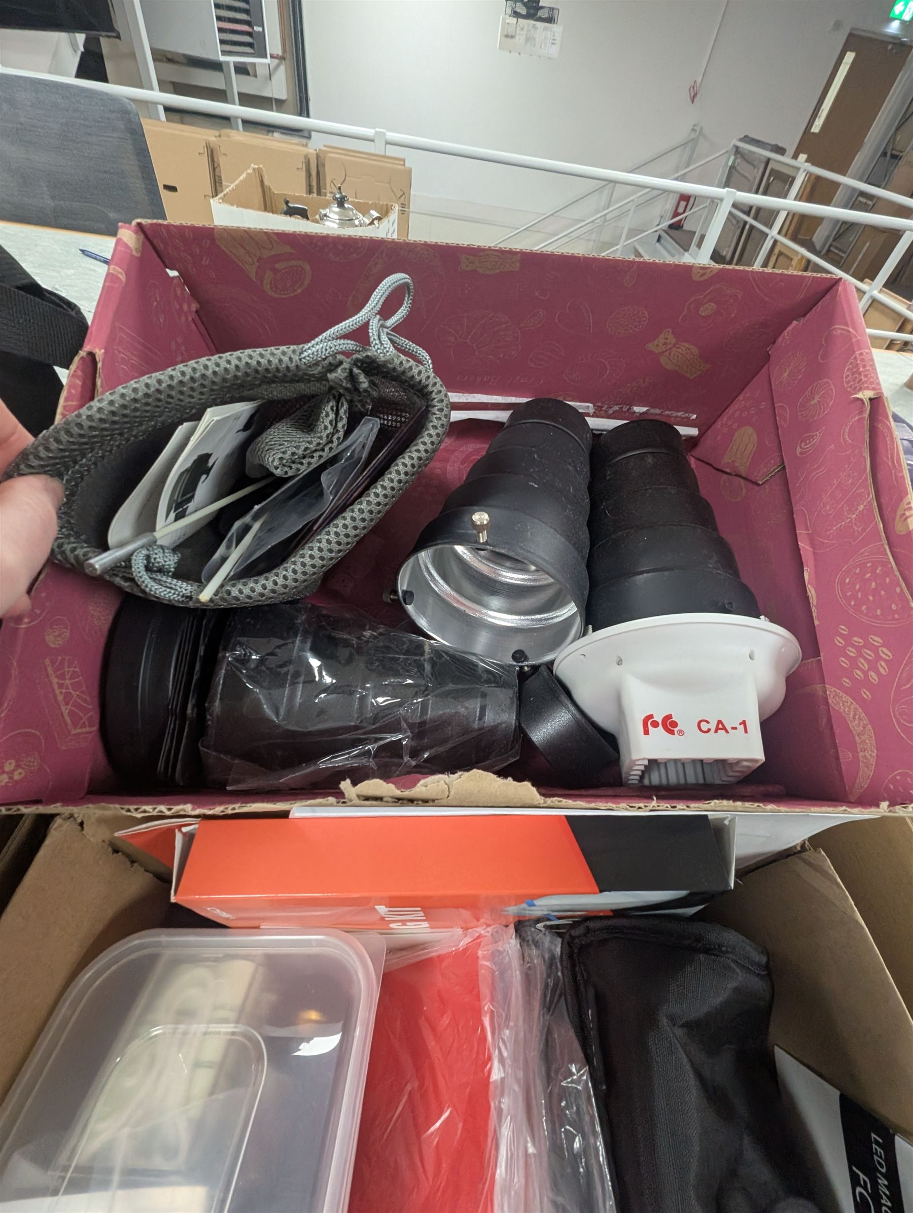 Collection of photography equipment, including flashes, hoods, filters, telephoto lens, bags, etc