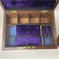 Walnut dressing table box, set with mother of pearl cartouche, opening to reveal a compartmentalised interior with mirror, covered in parts in purple velvet, together with a smaller jewellery box with stencil print, dressing table box H15cm