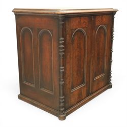 Victorian mahogany low cabinet, shaped rectangular top fitted with two arch panelled doors flanked by turned pilasters, enclosing two shelves and fitted with four short drawers with turned knobs 