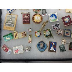 Over one hundred Soviet space programme badges; in two glass topped display boxes (2)