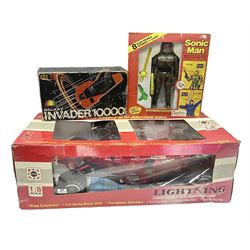 PMS Lightning 1:8 scale remote control racing car; Soma Sonic Man battery operated electronic sounds and light action figure; and CGL Galaxy Invader 10000 computer space battle game; all boxed (3)