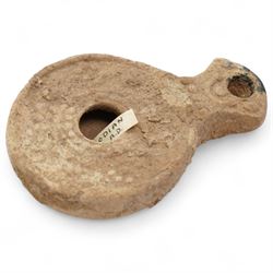 A group of five ancient terracotta oil lamps - Eastern Mediterranean (c.2nd century BC-1st century AD),
comprising a black-slipped Greek lamp (c.2nd-1st century BC) with a rounded body and narrow nozzle; a Herodian lamp (c.25 BC-75 AD) of compact form with central fill hole and pinched wick aperture; a Herodian lamp (c.1st century AD) with central raised disc and dotted ring motif; a Roman/Herodian hybrid lamp (c.50 BC-50 AD) with pronounced rounded shoulders and recessed top; and a further Roman/Herodian lamp (c.50 BC-50 AD) retaining an ancient carbonised wick fragment in the nozzle.
Provenance: By the vendor’s repute, acquired/collected in the Middle East (Dead Sea area/Syria) in the 1960s