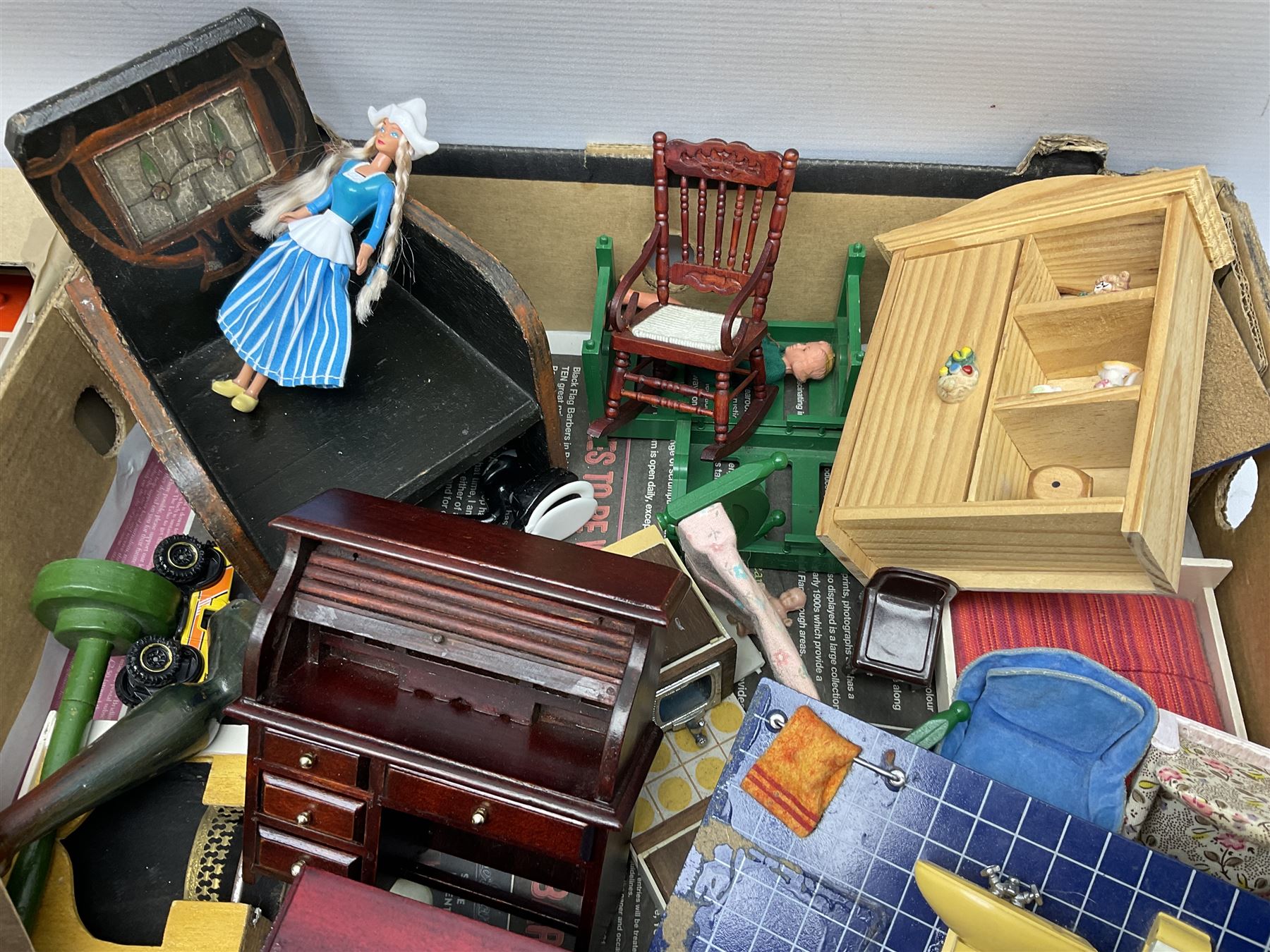 Large quantity of 1970s doll's house furniture, predominantly stained or painted wooden, including lounge, dining room, kitchen and bedroom pieces, bathroom fittings, bureaux and desks, piano, lamps, fire-surrounds etc; various scales