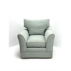 Traditional shaped armchair upholstered in duck egg blue fabric