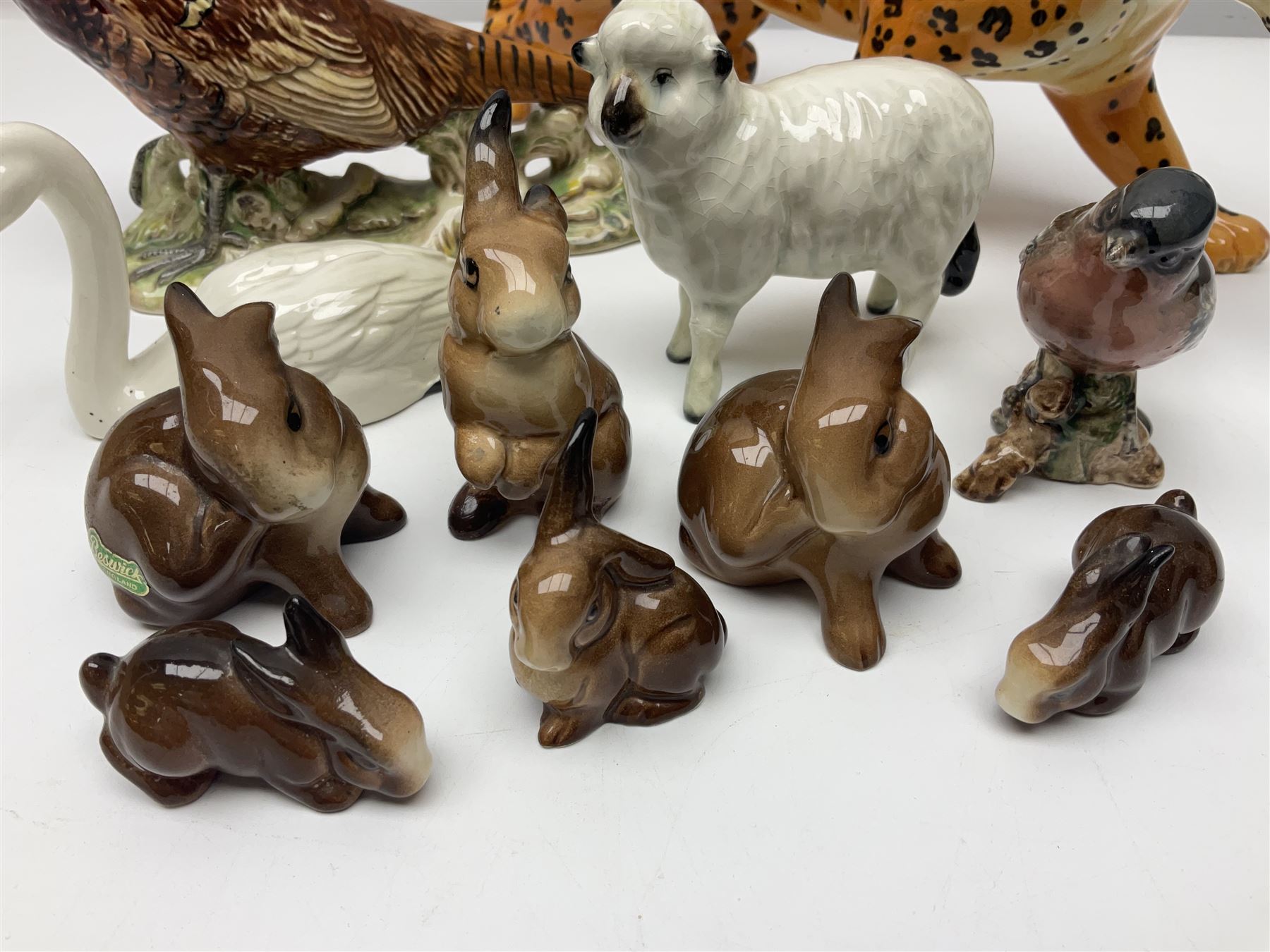 Group of Beswick figures to include leopard no 1082, rabbits, swan, pheasant no 1226 etc, all with marks beneath