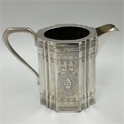 Victorian three-piece silver tea service, comprising teapot, twin handled open sucrier and milk jug, of oval form with shaped rim and C handles, each engraved with crests and bands of strapwork decoration, the milk jug and sucrier with gilt interiors, hallmarked Josiah Williams & Co, Exeter 1881, the teapot with ivory insulators and finial, all contained with a tooled leather, blue silk and velvet lined fitted case, retailed by West & Sun, Dublin 
This item has been registered for sale under Section 10 of the APHA Ivory Act