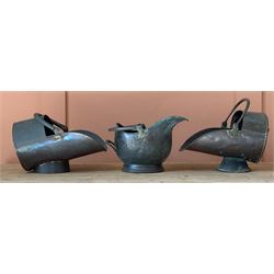 Group of three 19th century copper coal scuttles, each complete with coal scoop. (3)