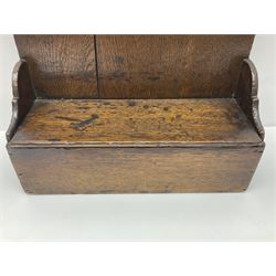 George III oak spoon rack and candle box, the rectangular backplate with shaped  pediment and two six aperture spoon racks, above a candlebox with hinged cover, with various brass spoons and a pair of brass candle snuffers, H56.5cm, W35cm, D14cm 