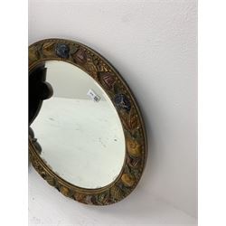 Three wall mirrors, comprising oval example with foliate carved and shaped frame, overall H71cm, circular example with frame carved and painted with fruits, overall D57cm, and a further example with 18th century style print above the rectangular mirror plate, overall H103.5cm.