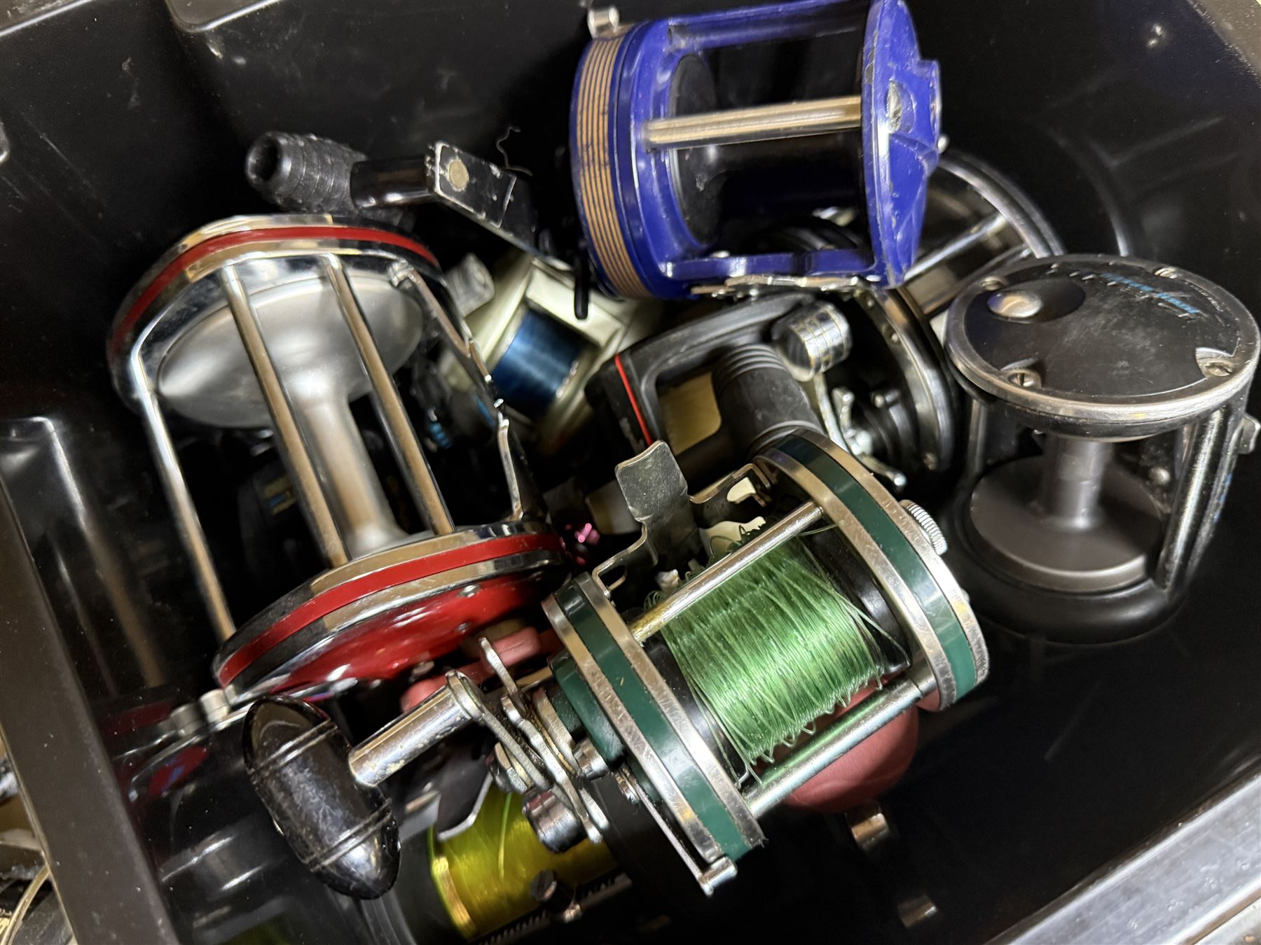 Collection of mostly sea fishing reels, including Mitchell Riptide, Shakespeare Sea Wolf, Daiwa Sealine, Abu Garcia Ambassadeur XLT 1 Synchro , in two boxes