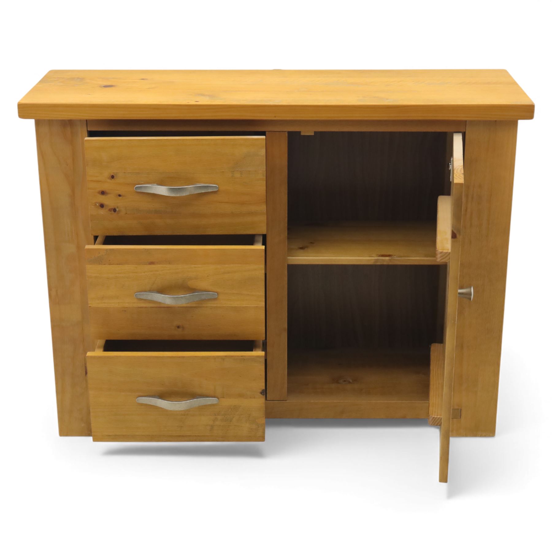 Contemporary pine side cabinet, rectangular top with moulded edge, fitted with three drawers with brushed metal handles alongside a single cupboard door with round metal knob, plain sides, raised on square block feet