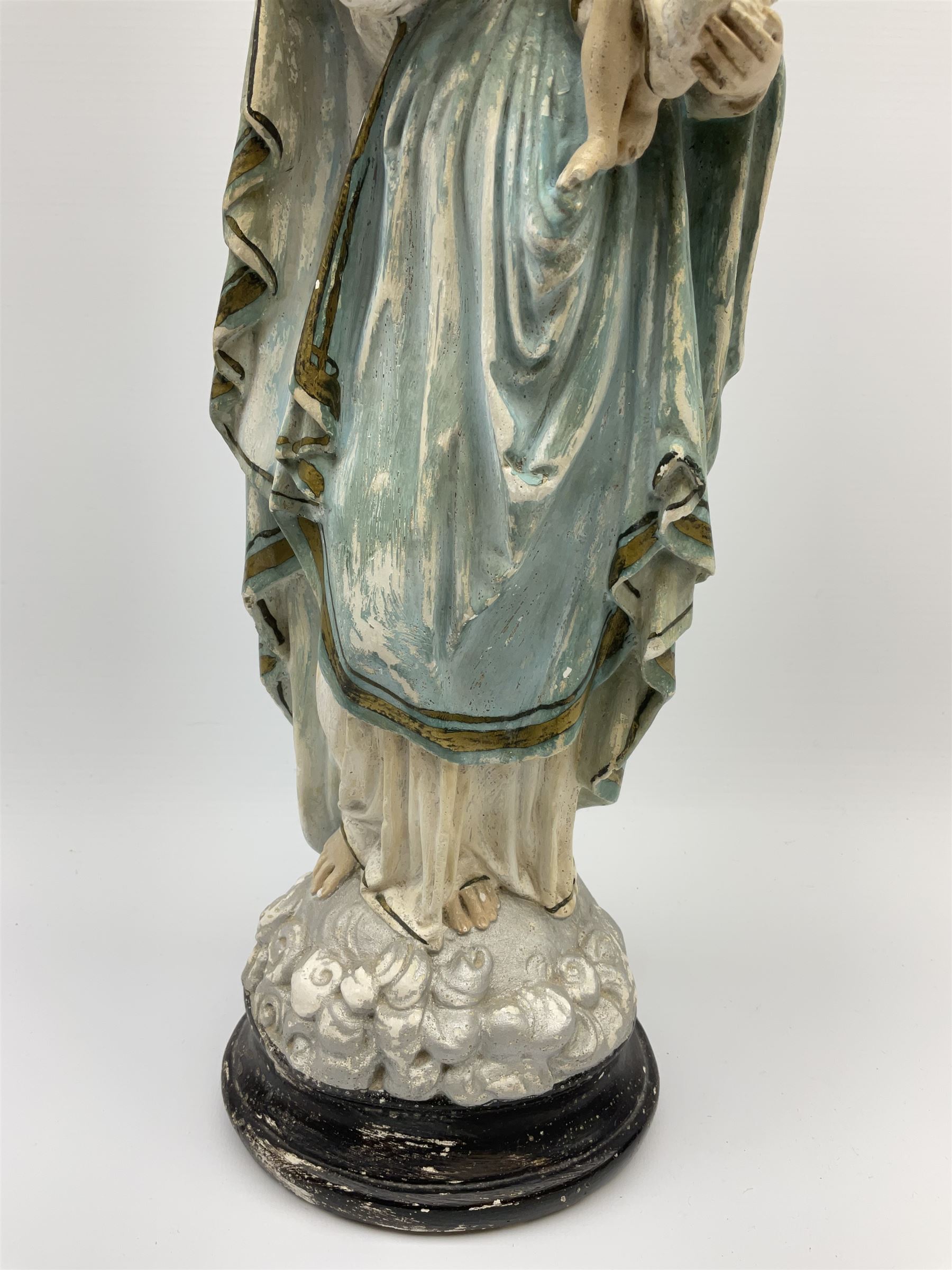 An early 20th century painted plaster figure modelled as Madonna and ...