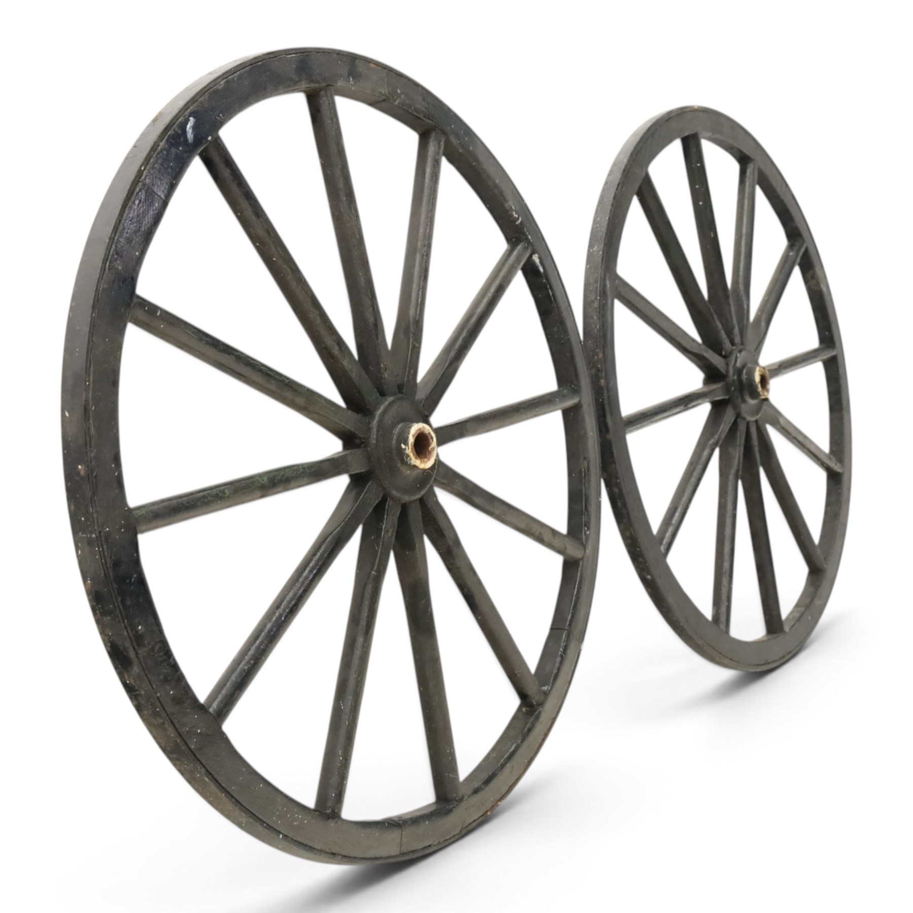 Pair of Victorian black lacquered and painted cartwheels with twelve spokes