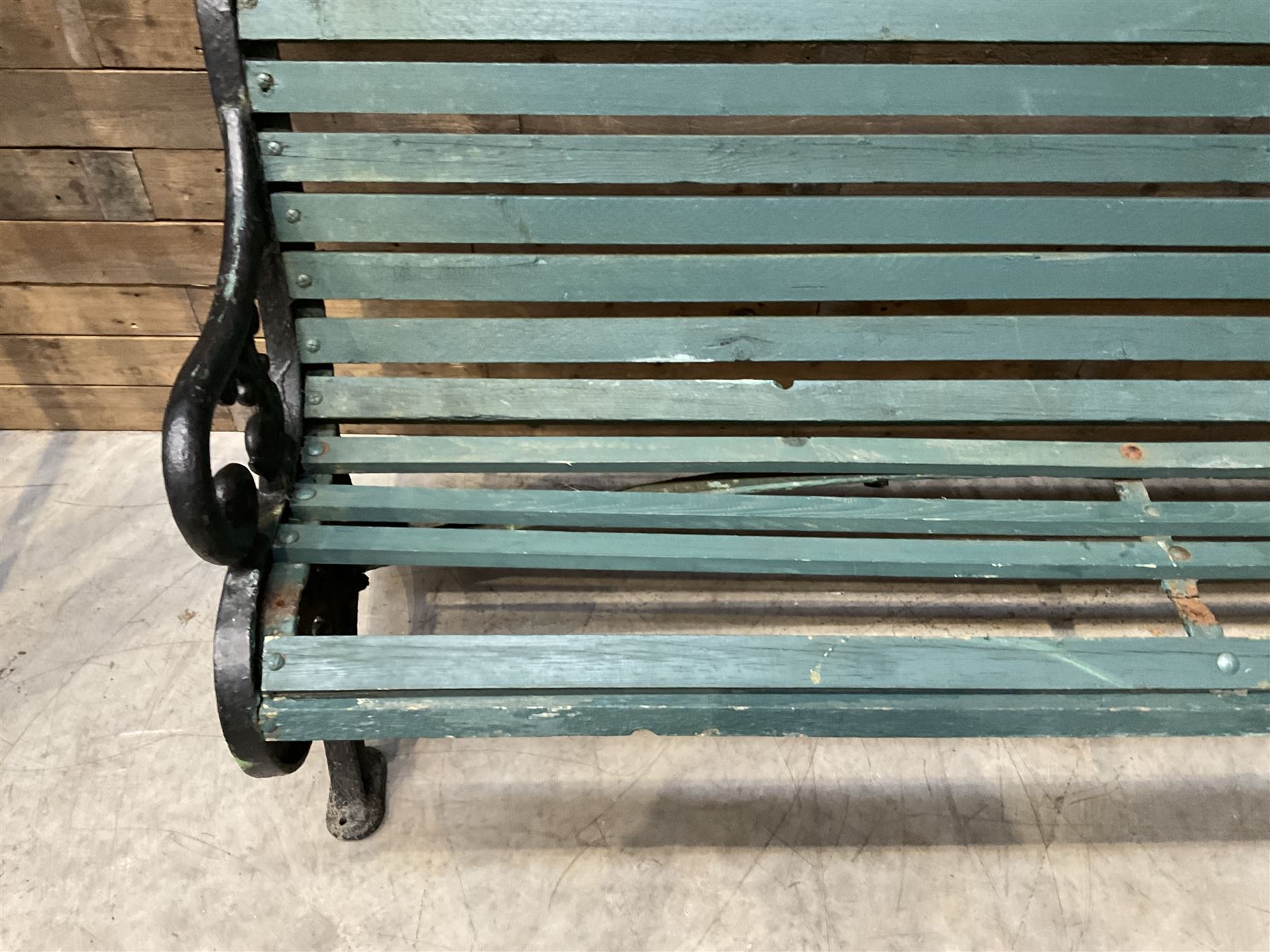 Early 20th century slatted garden bench with scrolling cast iron bench ends