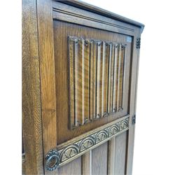 Early to mid 20th century oak hall wardrobe, single door with linenfold panel
