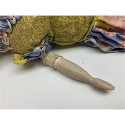 Victorian large wax over composition Pumpkin head doll, with inset dark glass eyes, moulded blonde hair in curls, stuffed body with carved and painted wooden limbs, grey painted boots, floral satin dress with netting underclothes H61cm