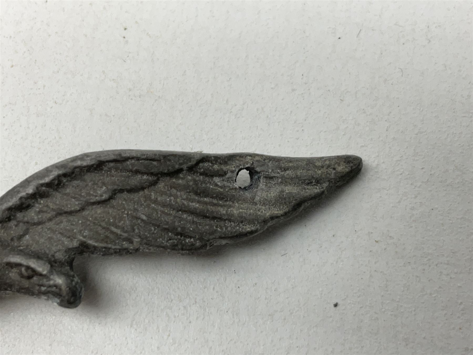 Five WW2 German peaked cap badges, four with double-pinned backs