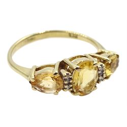 9ct gold three stone oval citrine and diamond ring, hallmarked 