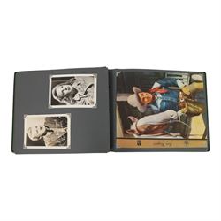 Collection of photographs and postcards, mostly depicting 1940s film stars, including some autographed examples and some with printed signatures, together with a collection of Shirley Temple  promotional photographs,1930s autograph album and postcards of the Royal Family