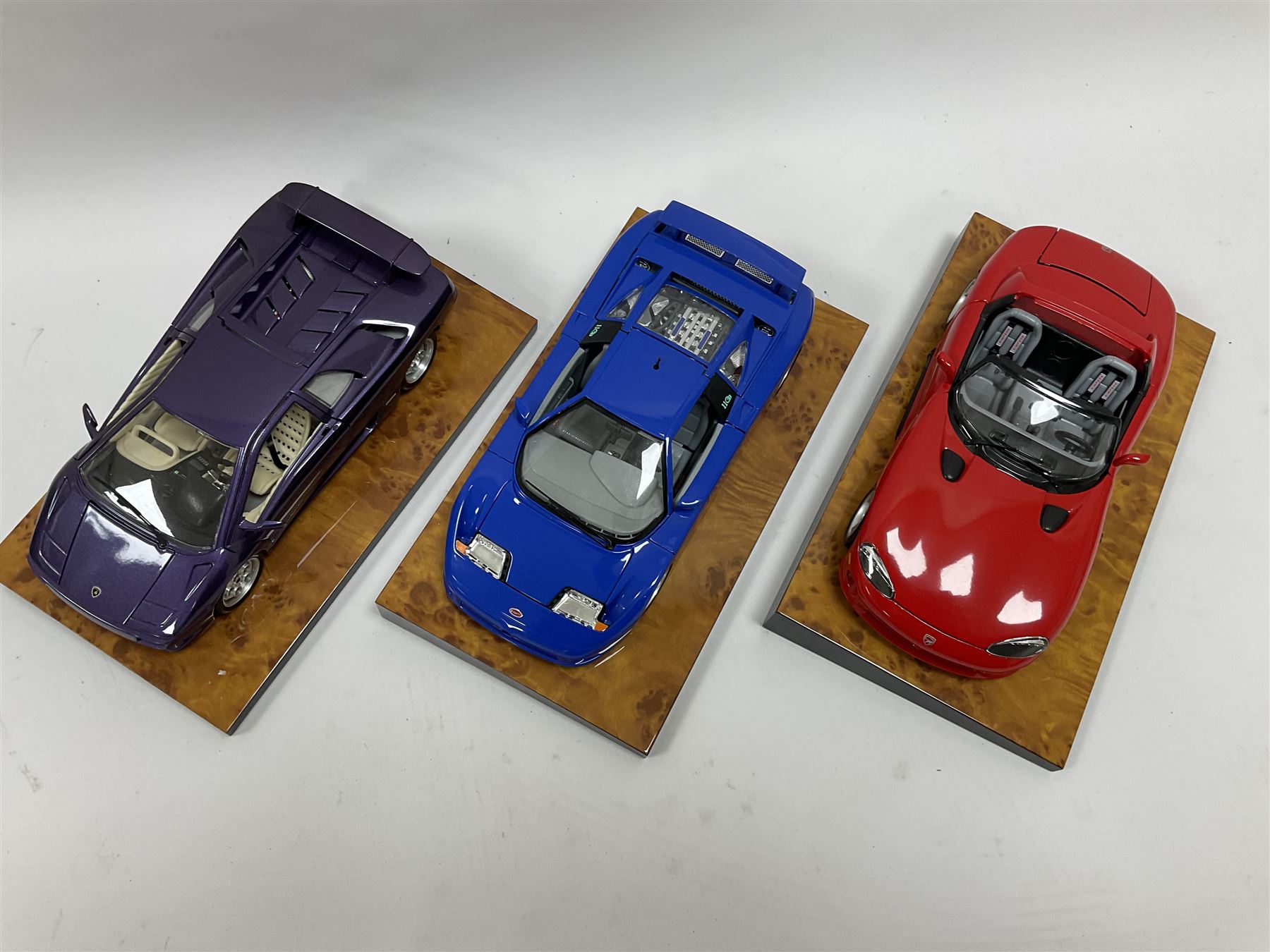 Three The Crestley Collection 1:18 scale model cars comprising