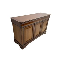 Cherry wood sideboard, fitted with three cushion drawers over three panelled cupboard doors, on bracket feet