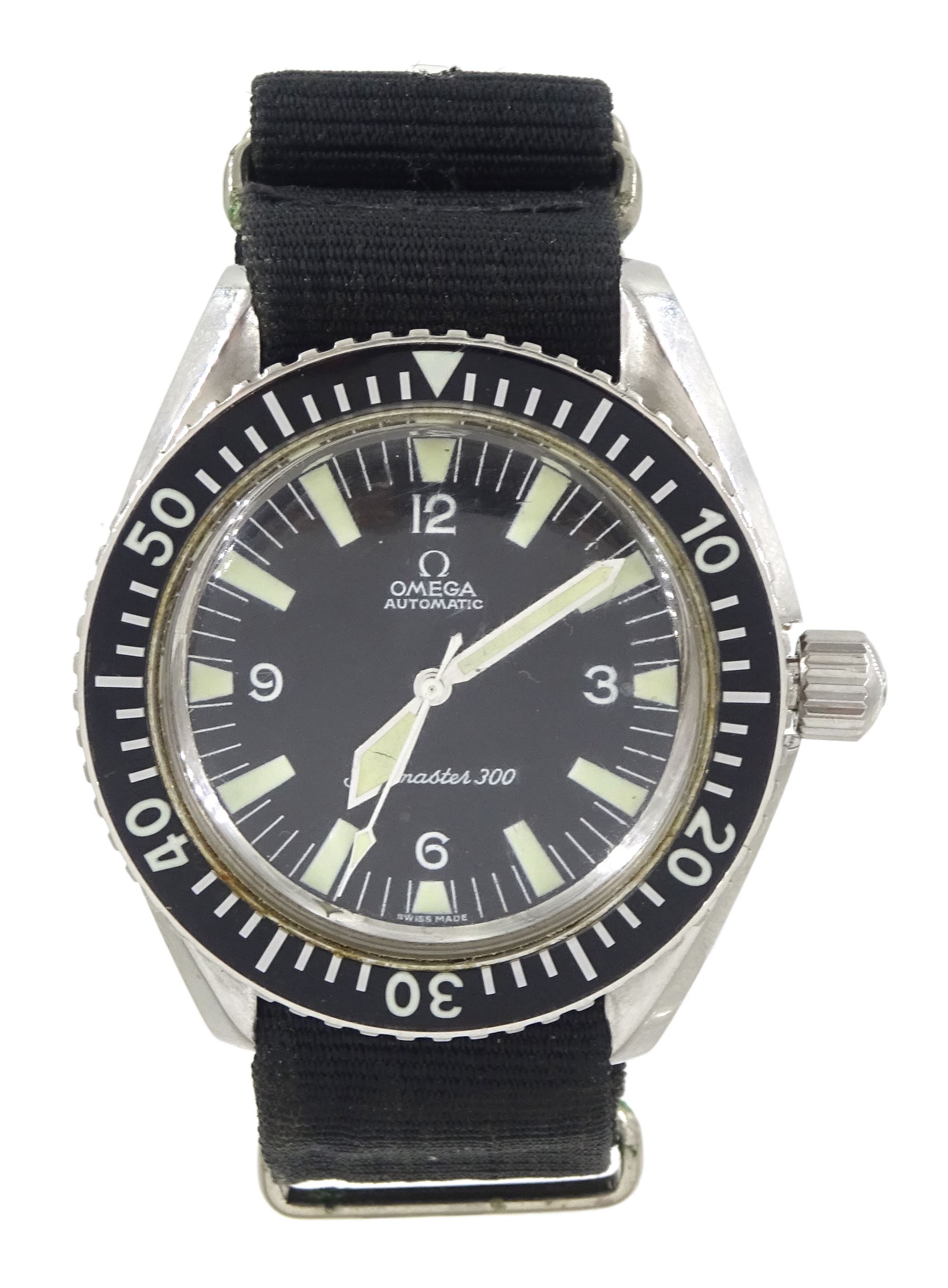Omega Seamaster 300 gentleman's stainless steel automatic wristwatch, circa 1966, Ref. 165.024, Cal 552, serial No. 23468431, black dial with luminous baton hour markers and Arabic numeral quarters, white outer minute divisions, polished sword hands with luminous inserts, on black fabric strap
