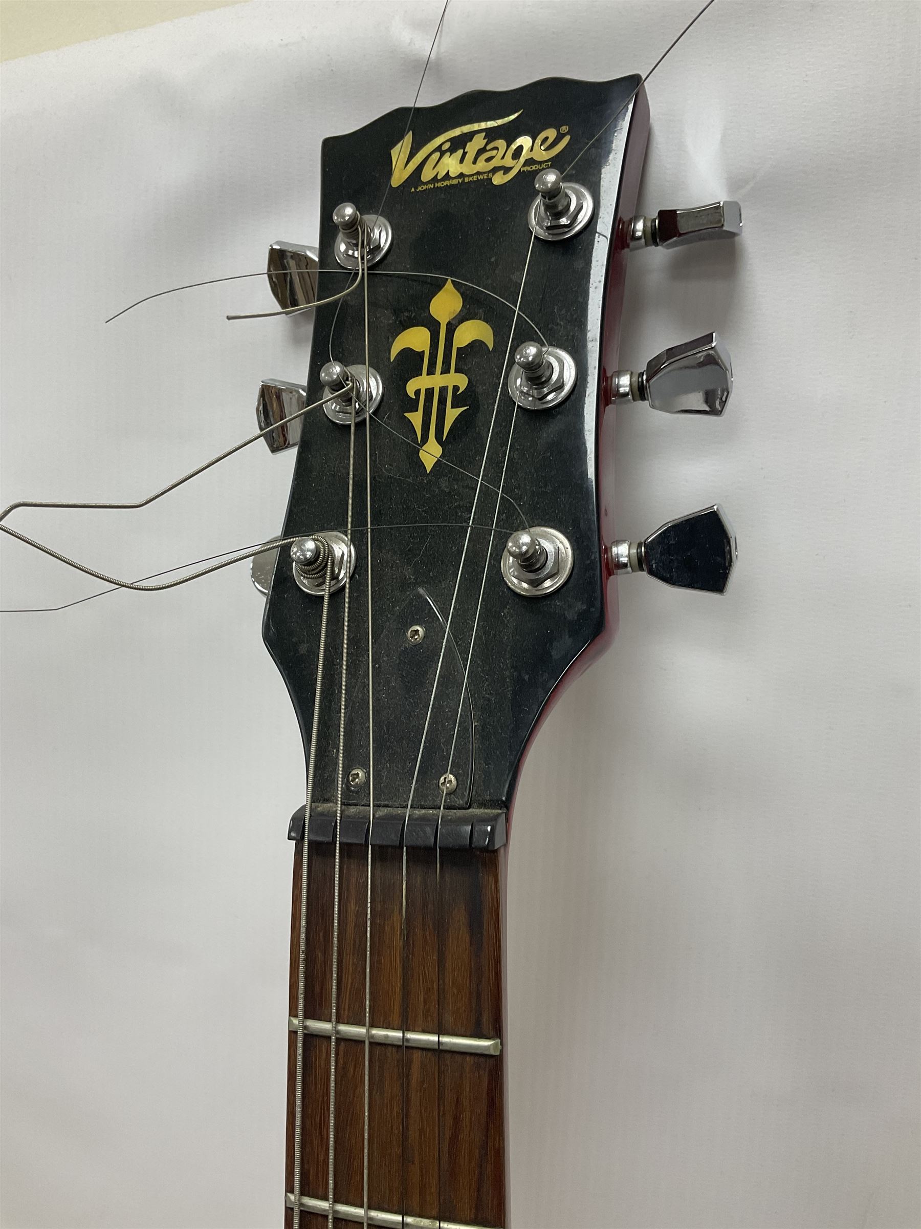 Vintage VS6M Reissued Series six string electric guitar, with solid body in cherry red finish, in carrying case, guitar L103cm